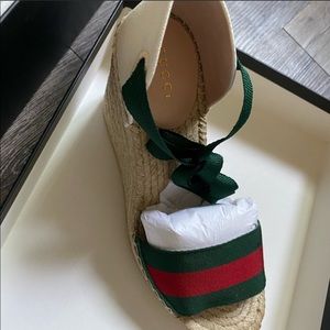 New and authentic Gucci wedge,7.5 but fits like 7